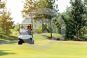 Group Professional Golfer asian man and friend sitting on the car golf go to golf course shot continue game.  Hobby in holiday and