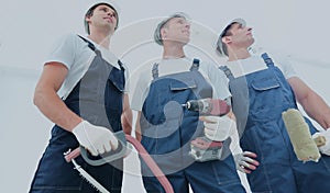 Group of professional industrial workers. Isolated over white background.