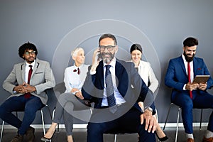 Group of proffesional business people communicating in modern office