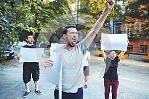 Group of protesting young people outdoors