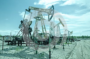 Group of pump jack and wellhead in the oilfield