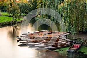 Group of punts docked on the side of rive Cam, Cambridge, UK