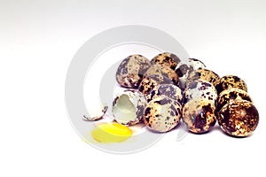 Group quail eggs cracked on white background