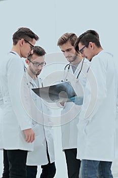 Group of radiologists discussing x-ray