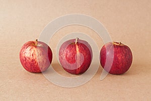 Group of red apples on brown paper background