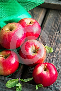 group of red apples on wooden natural background, fresh natural food and vitamins concept in rustic style