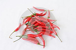 Group of red chilies on white background