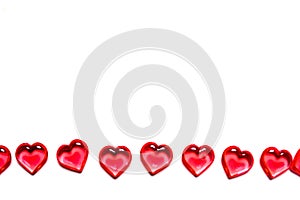 A group of red hearts on a white background with copy space. Valentine`s day theme.