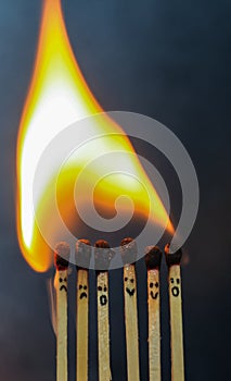 Group of a red match burning isolated with the background. Row burning matchstick in the chain reaction. Matchstick art.