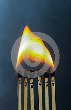 Group of a red match burning isolated with the background. Row burning matchstick in the chain reaction. Matchstick art.