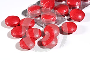 Group of red medicine pills