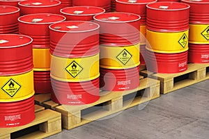 Group of red oil drums on shipping pallets in the storage warehouse