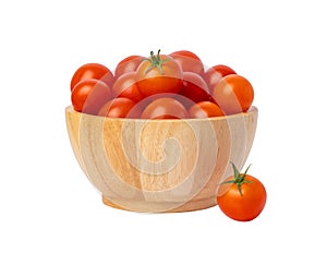 Group red tomatoes in a wooden bowl isolated