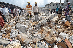 A group of rescuers begins to dismantle the rubble in search of trapped people