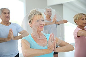 Group of retires people doing stretching