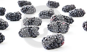 Group of ripe blackberry on a white background