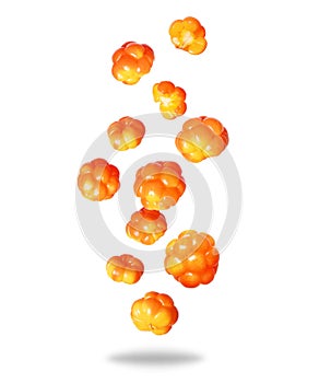 Group of ripe juicy cloudberries close up in the air isolated on a white background