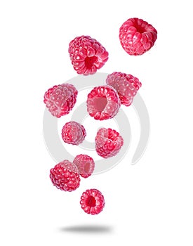 Group of ripe juicy raspberries close up in the air isolated on a white background