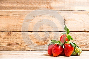 Group ripe red strawberry on wooden table