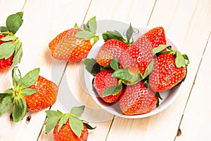 Group ripe red strawberry on wooden table