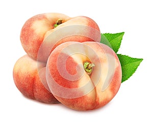 Group of ripe sweet donut peaches with leaves isolated on white background.