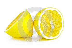 Group of ripe whole yellow lemon citrus fruit with lemon fruit half on white background with clipping path