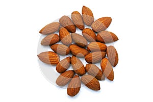 Group of roast almonds isolated on white background