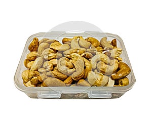 Group of Roast Cashews in plastic box on white