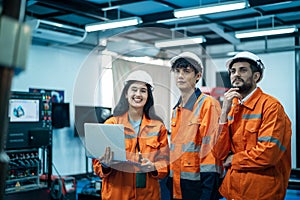 Group of Robotics engineers working with Programming and Manipulating Robot Hand, Industrial Robotics Design, High Tech Facility