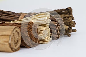 A group of rolled wooden decorative items