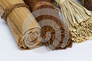 A group of rolled wooden decorative items