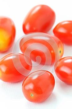 Group of Roma Tomatoes isolated on white background, macro