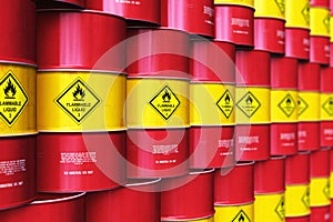 Group of rows of red stacked oil drums in storage warehouse