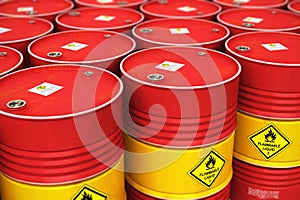 Group of rows of red stacked oil drums in storage warehouse