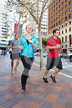 Group Of Runners On Urban Street