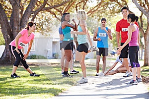 Group Of Runners Warming Up Before Race