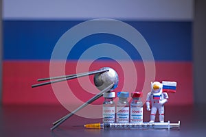 Group of russian vaccines named after a well-known russian satellite against Covid 19 virus with syringe and small astronaut. Tag