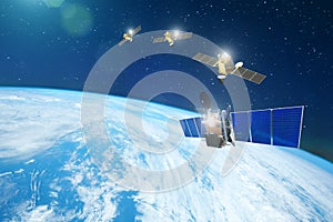 Group of satellites in a row orbiting the earth, for communication and monitoring systems. Elements of this image furnished by