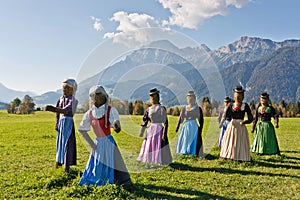 Group of scarecrows standing on a field