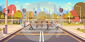 Group Of School Children Crossing Road On Crosswalk With Traffic Lights