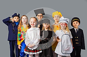 Group of school children dressing up as professions