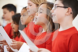 Group Of School Children Singing In Choir Together photo