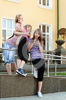 Group of school girls calling on the cell phones