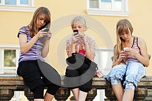 Group of teen girls calling on the phones