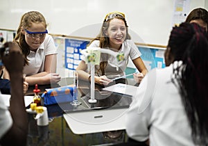 Group of school girls learning science class