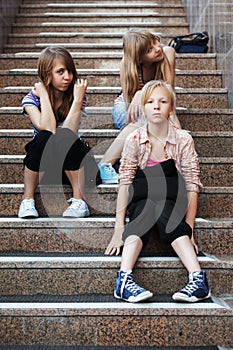 Group of school girls sitting on the steps