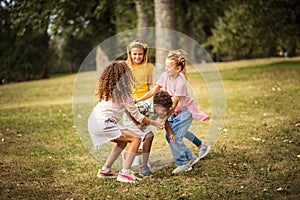 Group of school kids having fun in nature