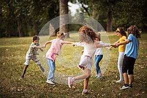 Group of school kids having fun in nature