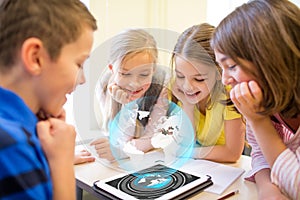 Group of school kids with tablet pc in classroom