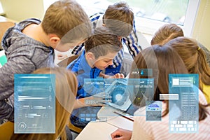 Group of school kids with tablet pc in classroom